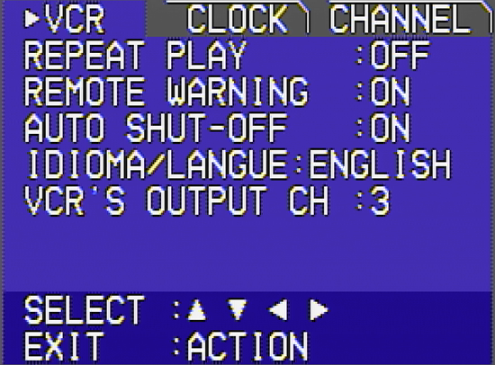 A screengrab of my VCR; you can see some analog distortion in the signal. It's a basic menu system consiting of a bunch of text, like asking you if you want Repeat Play on, Auto Shut-Off, etc., there's also 3 tabs at the top of the screen, for the VCR, Clock, and Channel settings.